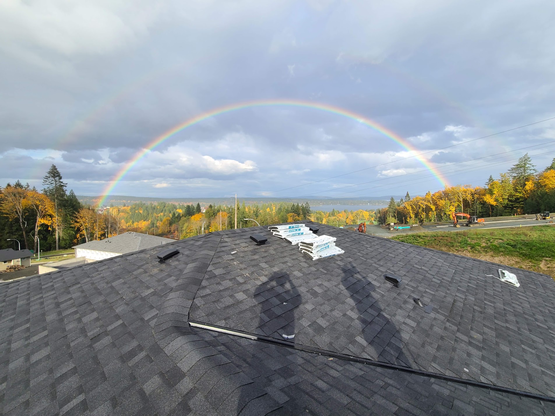 Rooftop view with rainbow over Vancouver Island